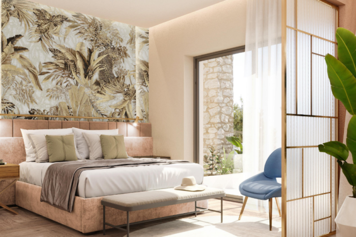 Villa Epavlis. Luxurious queen-sized bed in the first apartment, offering ultimate comfort and elegance